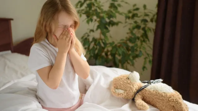 young girl with house dust mite allergy