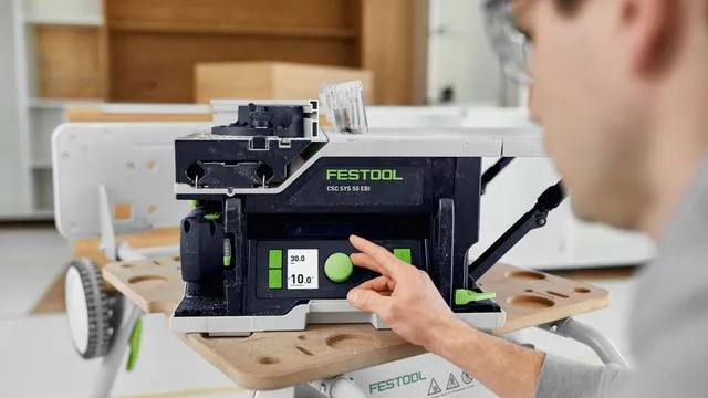man sets saw