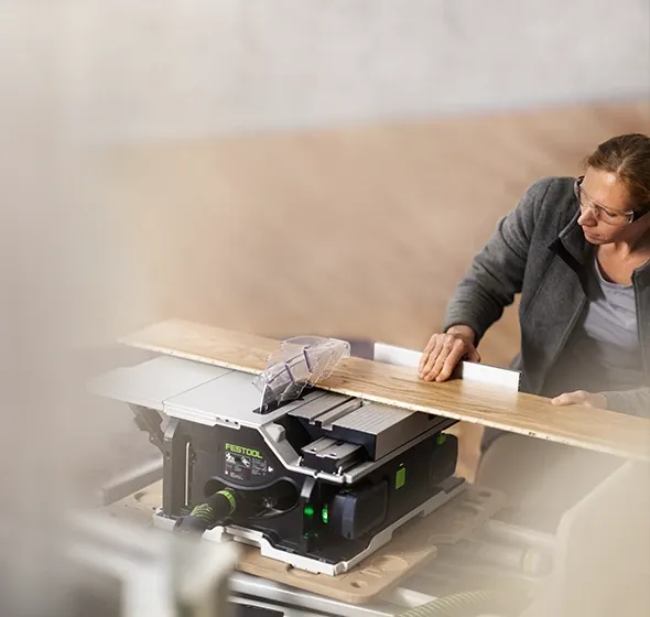 Man using a Festool table saw