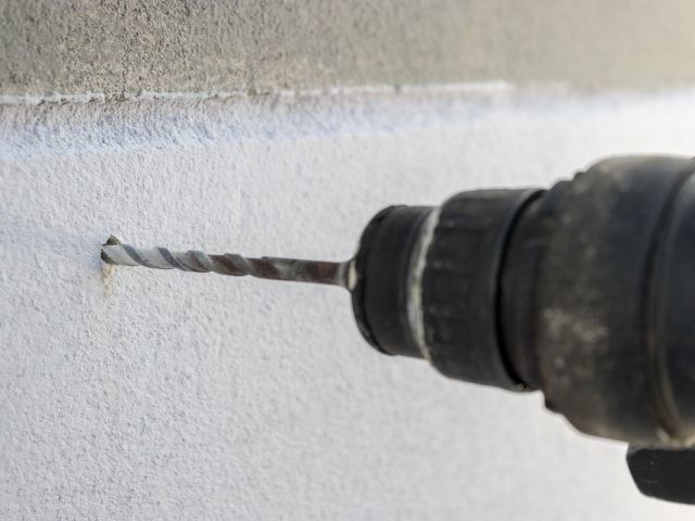 Drilling with an impact drill
